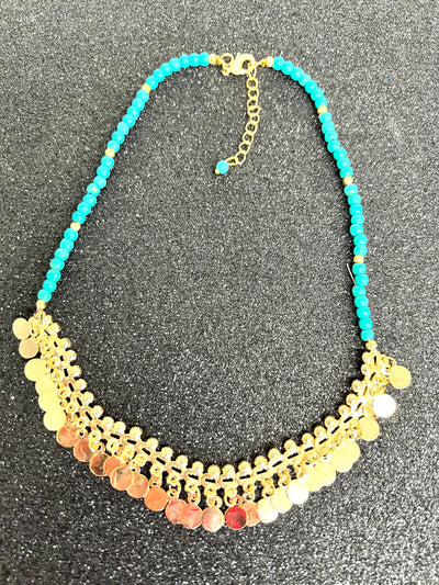 Collar piedras lila y circulos oro Turcas